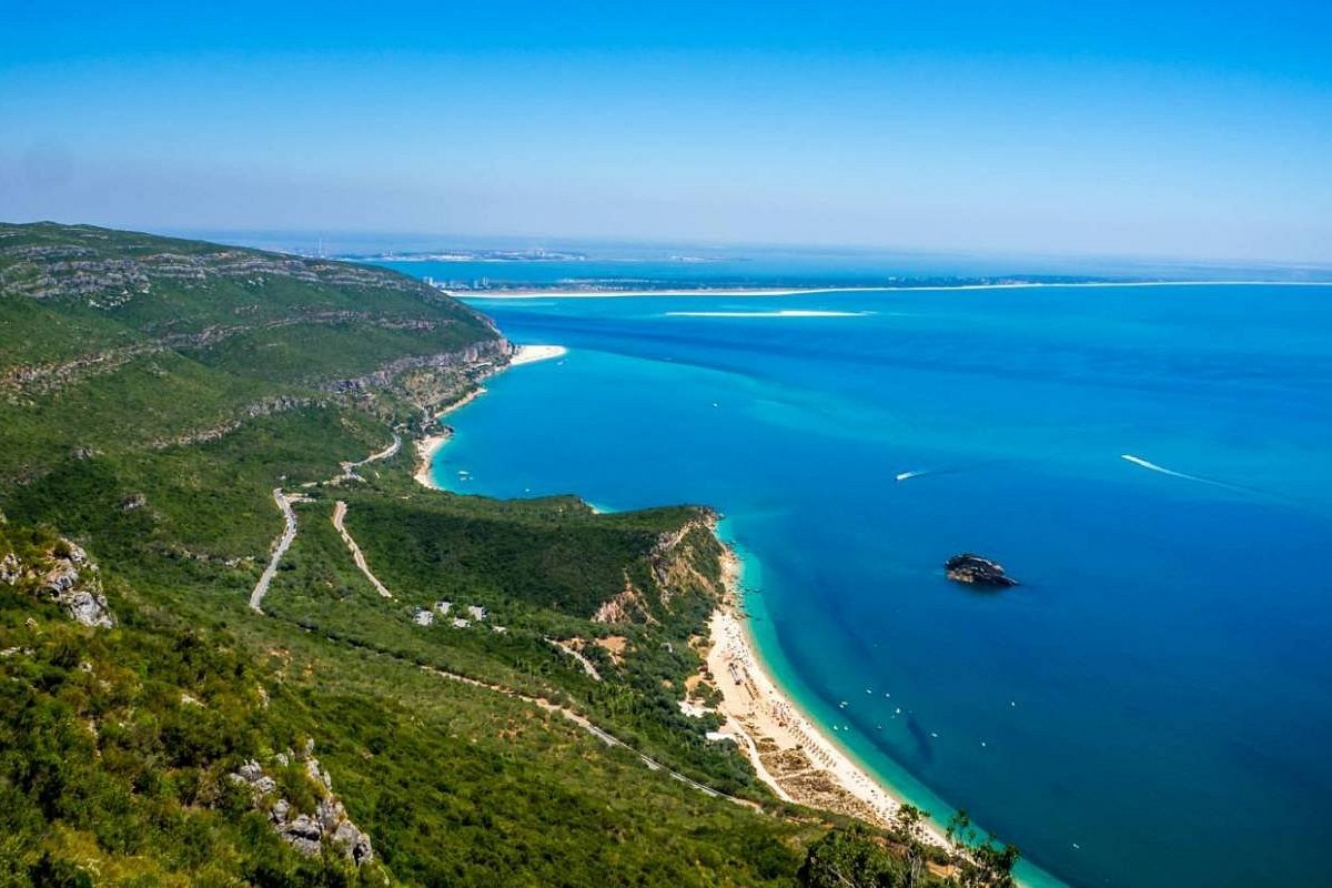 Green Arrábida hills above the blue sea and beaches
