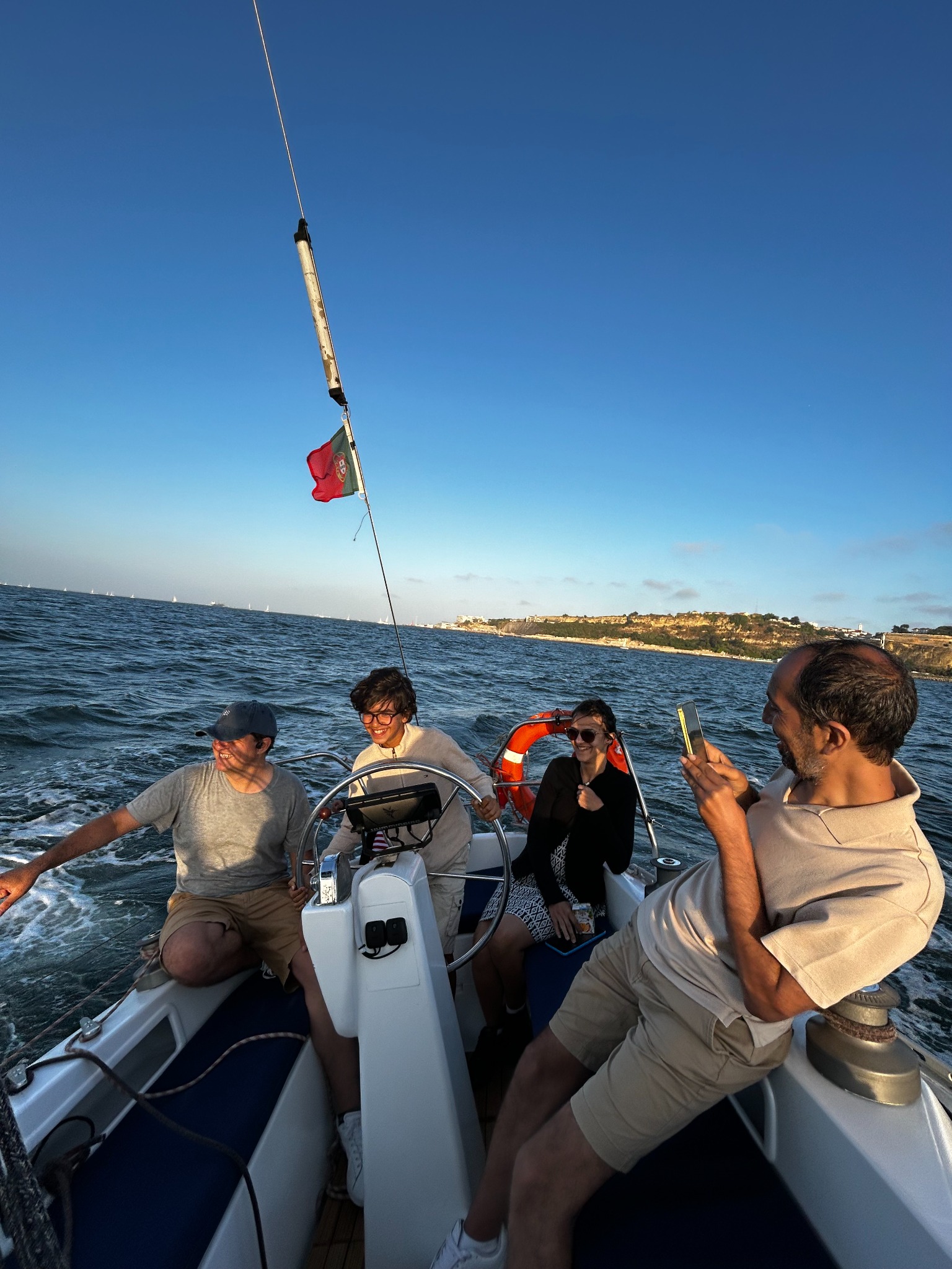 Guests enjoying a sunny sail together